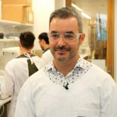 Fernando standing in a lab